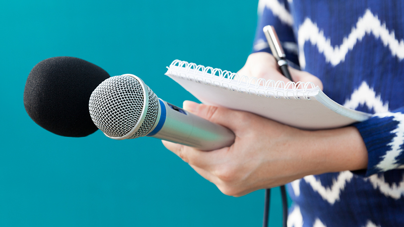 student holding a microphone