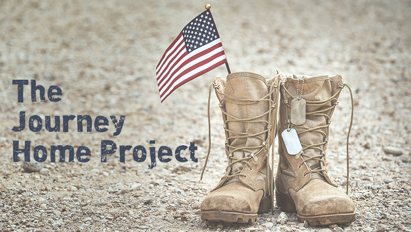 worn boots with two small American flags  