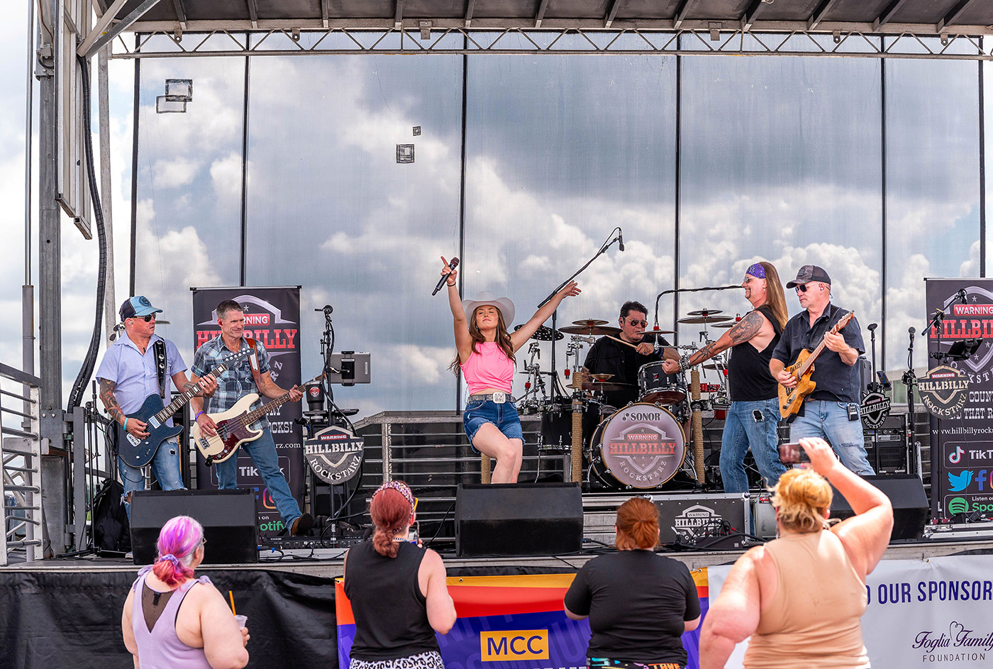 the hillbilly rockstarz perform on a stage at MCC's Block Party