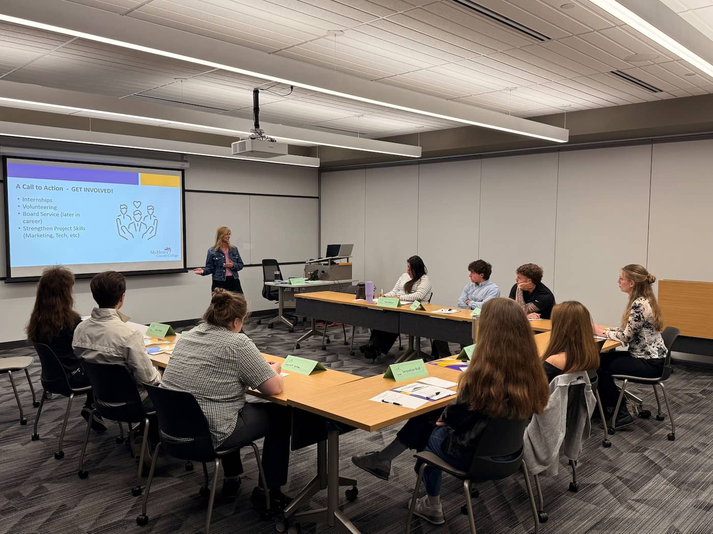 students listen to a presentation during nonprofit internship training