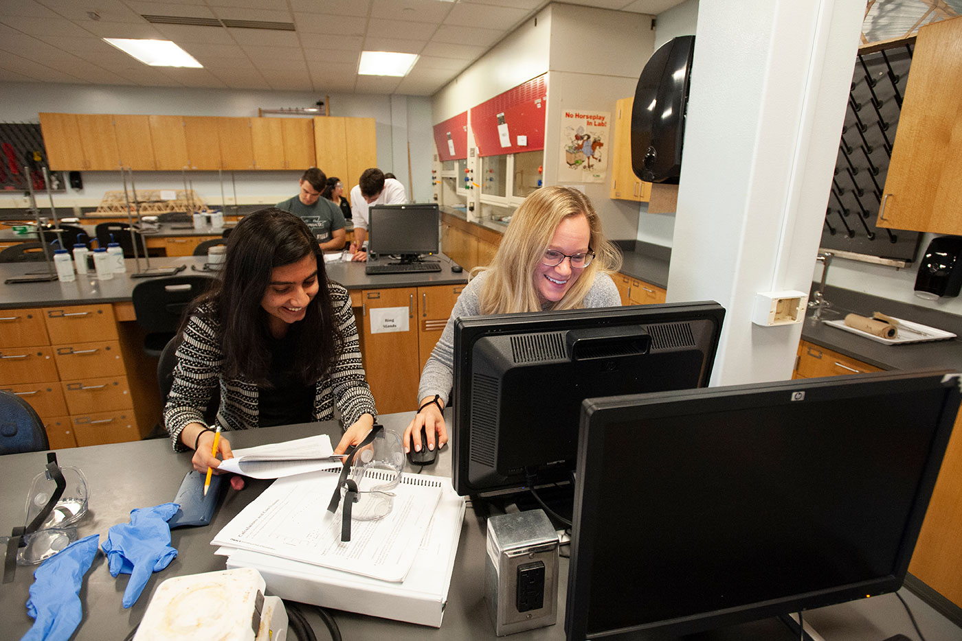 two students on computer in science lab