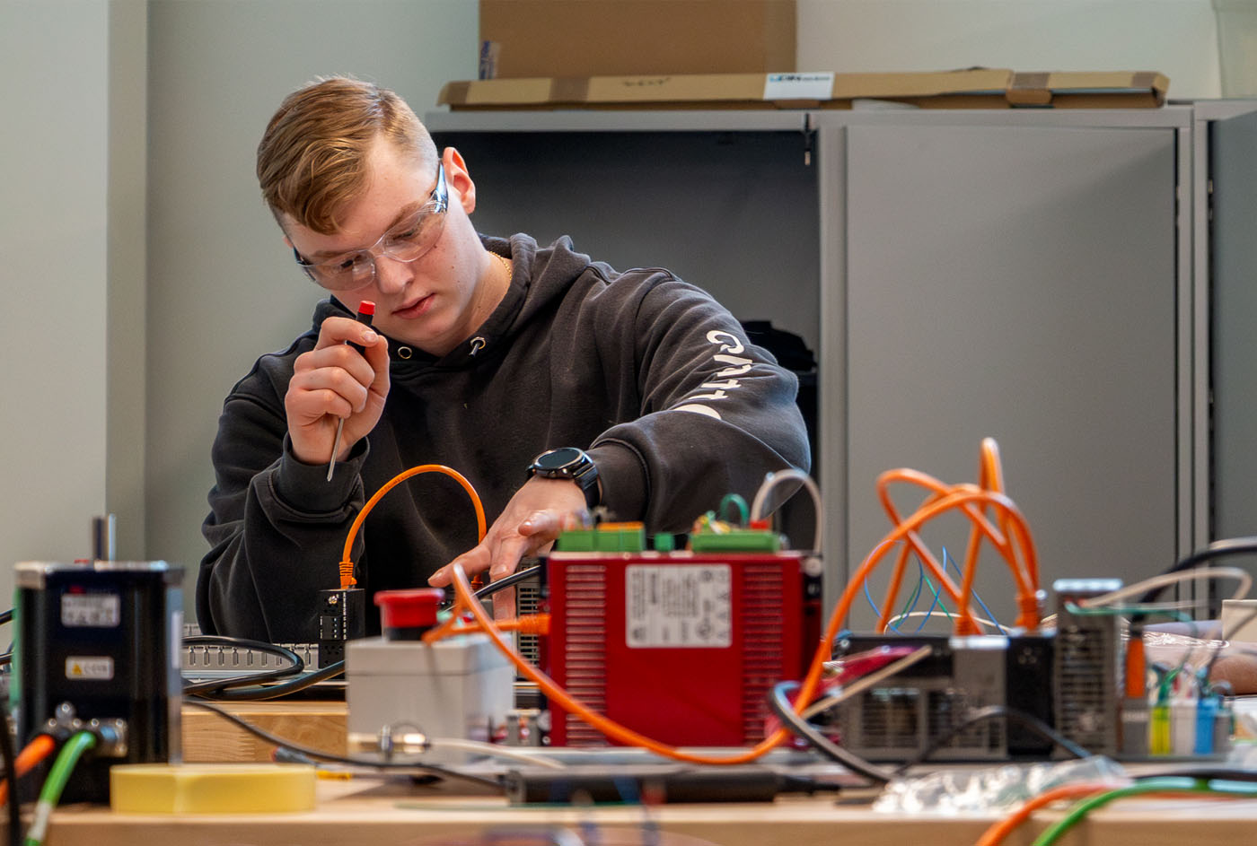 a student doing electrical work