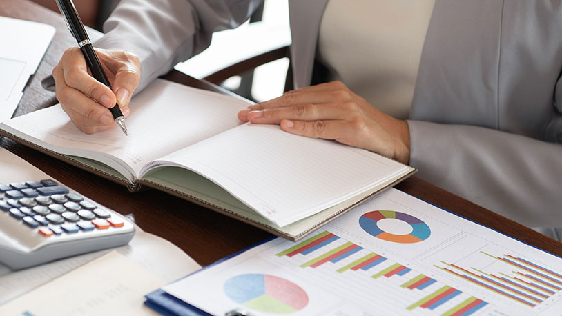 accountant with journal and calculator