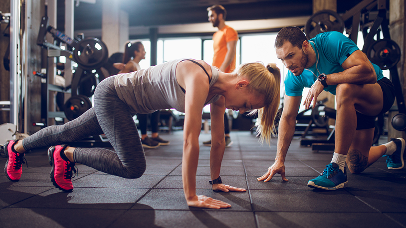 girl in gym doing floor exercises