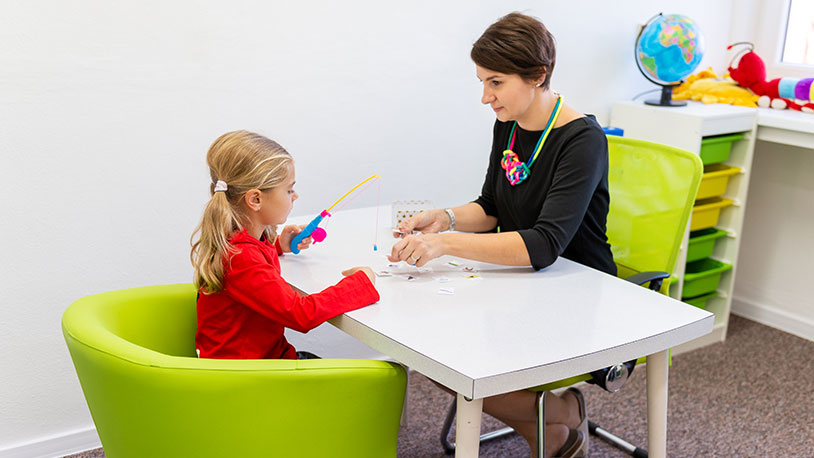 Occupational Therapist working with young child 