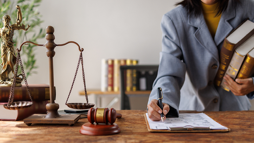 close up of gavel and striking block with scale