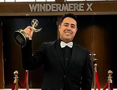 Emmy-Winning Producer, MCC Alum Andrew Nuño holding his Emmy