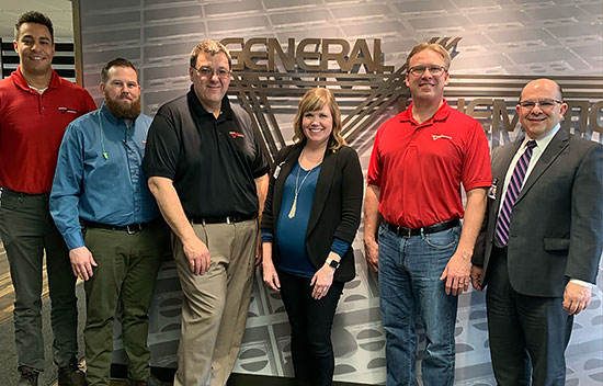 Vince Brice, Design Engineer; Jason Jerik, Plant Manager; Joel Jacobson, Director of Manufacturing; Jessica Rizza, Tom Musschoot, President; and Brian DiBona
