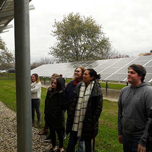 Energy Resource Lab students examine a solar array 
